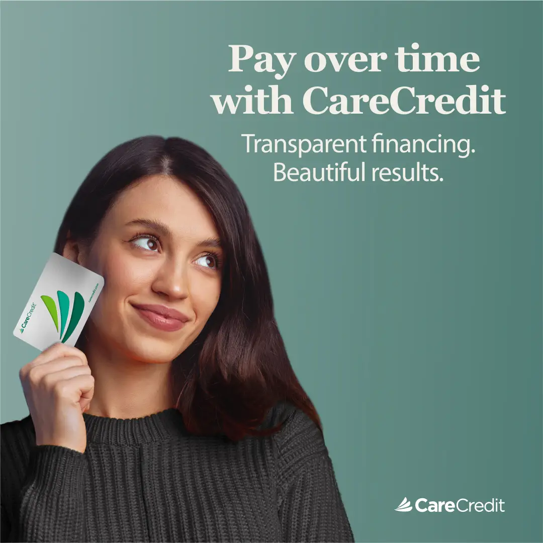 Image of a woman holding a carecredit card for Med Spa treatment financing